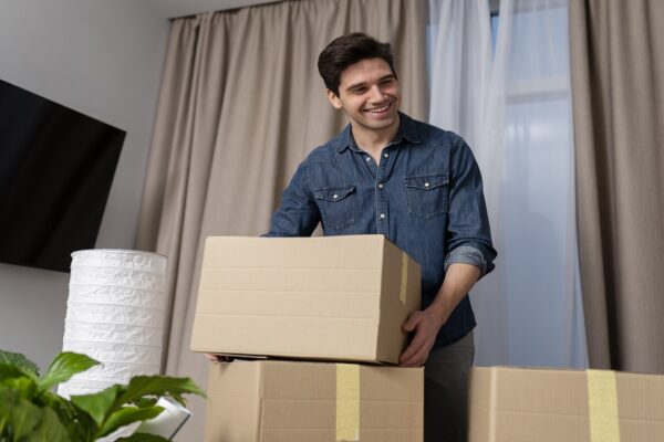 man handling belongings after moving new home